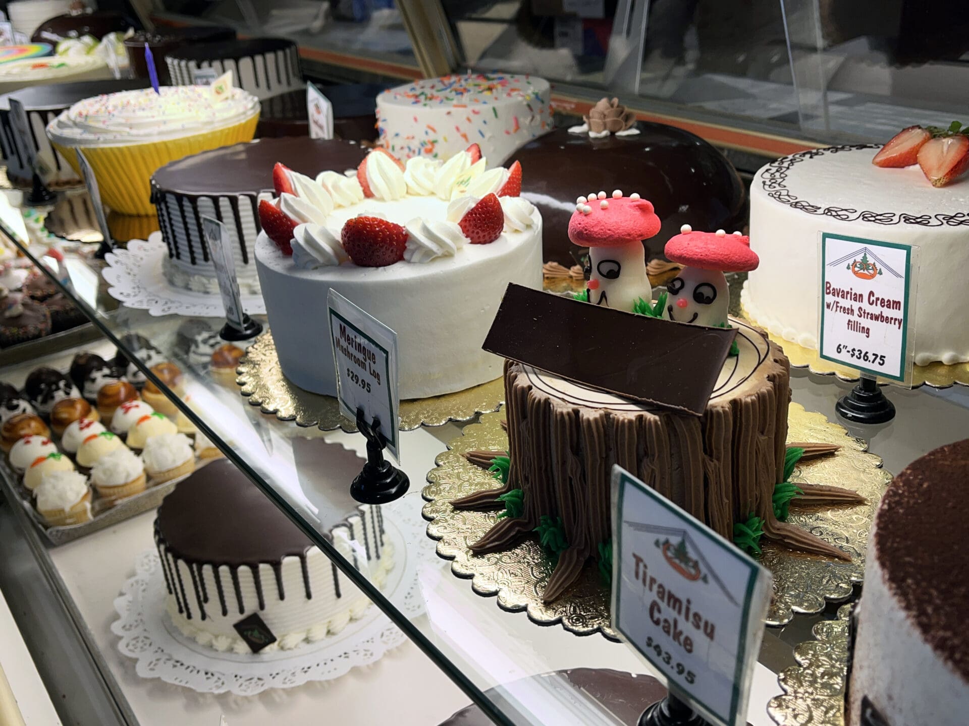 cakes on display in a bakery