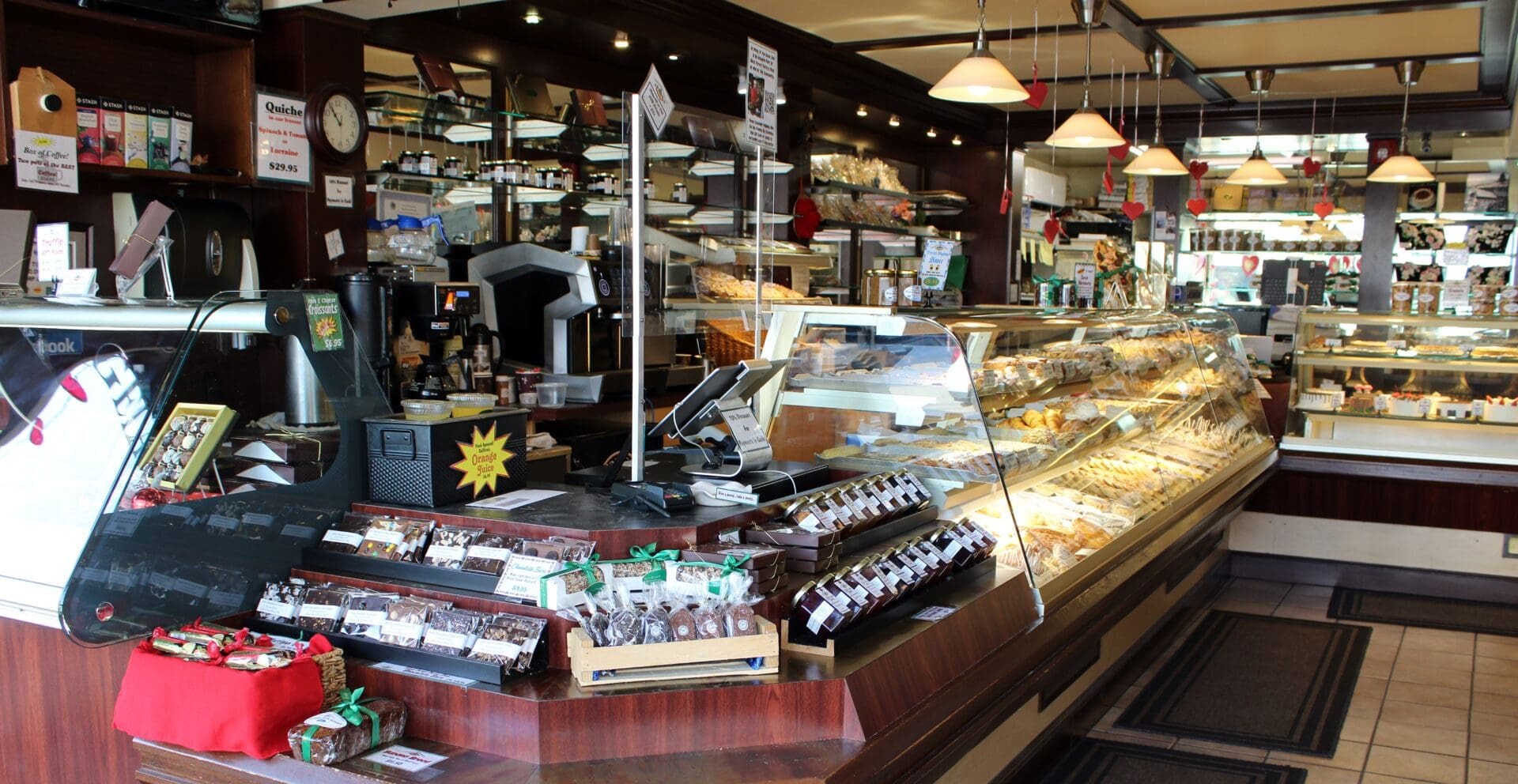a bakery with a counter full of pastries