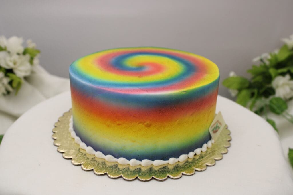 Vanilla cake layers dyed to look like the rainbow colors, Vanilla Buttercream Filling, Vanilla Buttercream icing dyed to look like a rainbow.