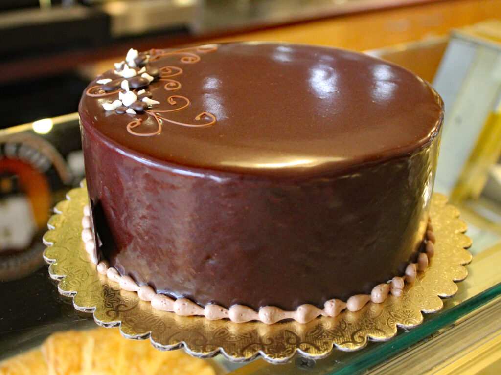 2 Layers of Dense Flourless Chocolate Cake, Chocolate Mousse Filling, Chocolate Ganache icing. *Gluten Free*