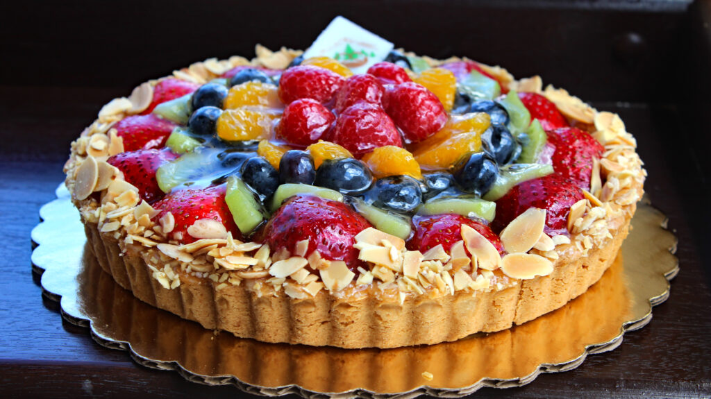 Sliced fresh fruit served on top of a thin layer of bavarian cream and a shortbread crust. Perfect for warm weather!